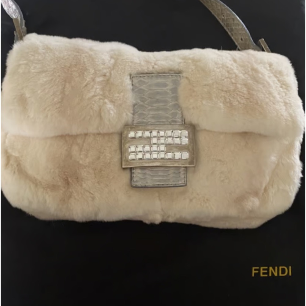 Fendi vintage fur  baguette. It can be worn w/o strap .. Rhinestone F clasp